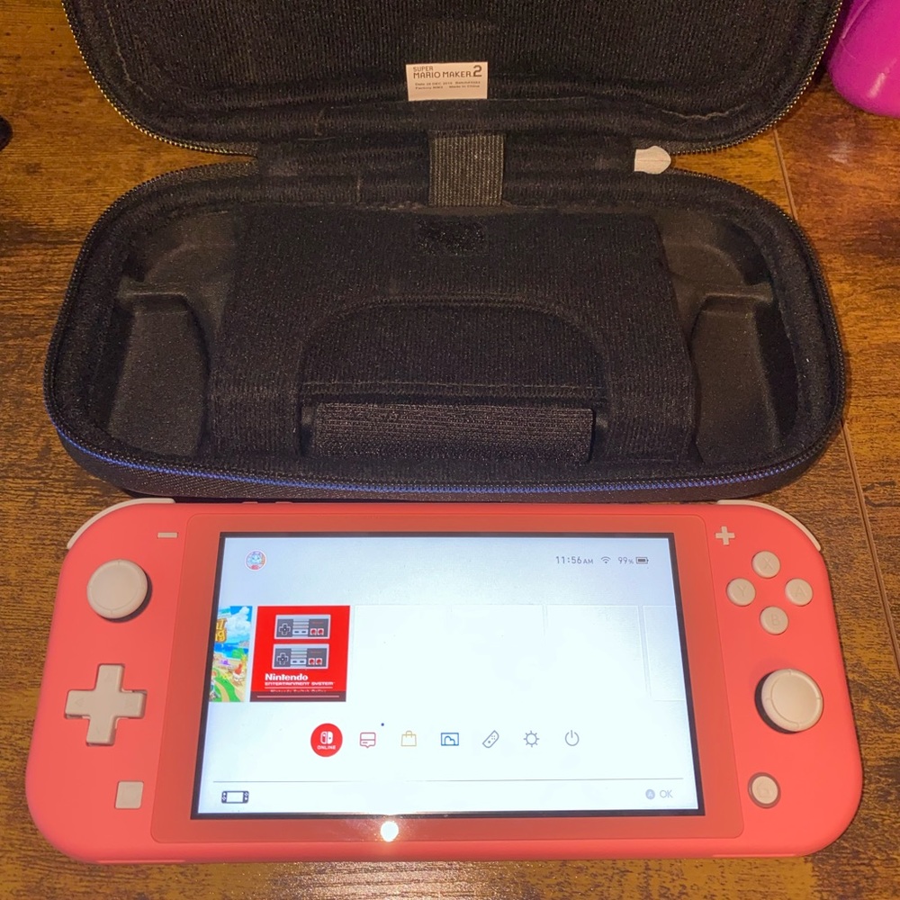 Coral Nintendo switch lite with case no games just switch and case